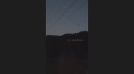 orb with cool energy feild cruising through the evening sky with lots of other mysterious activity going on around it