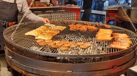 Authentic German Street Food: Sausages Grilled to Perfection at Busy Food Stall