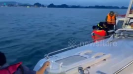 Divers search for survivors in capsized boat in Vietnam