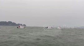 Boat capsizes in Vietnam leaving dozens dead as storm batters region