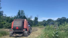 Farmers cutting hay in the field on Cedar Hill Road Pownal Vermont