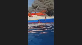 Burning Ship Panic: Dozens of KM Barcelona 5 Passengers Struggle in the Sea Awaiting Rescue