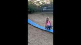 Man slips and spills drink during backyard slide attempt in Pfungstadt, Germany