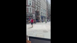 Bicyclist makes clumsy entrance by crashing into signboard in London, England, UK