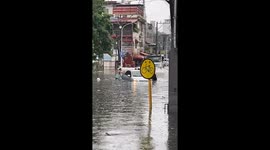 Drivers tackle flooded roads as monsoon lashes the Philippines