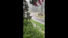 Continuous rainfall causes road flooding in Silver Spring, Maryland, USA