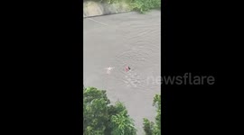Heroic firefighters rescue helpless woman swept away by typhoon floods in China