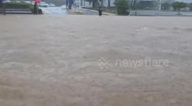 Cars washed away by flash floods in South Korea