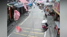 Scooter rider doing wheelie on scooter smashes straight into irate motorist's SUV