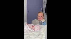 Sisters meet their newborn sibling for the first time in Saint-Herblain, France