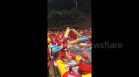 Chaos ensues as dozens of rafting tourists pile-up leading to multiple capsize in China