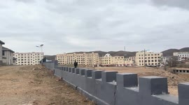Black cat continuously hops between wall merlons in Inner Mongolia, China