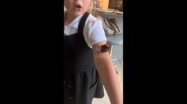 Little girl panics as butterfly climbs her shoulder in Manchester, England, UK