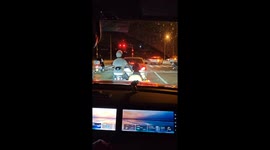 Dog patiently waits on motorcycle sidecar at traffic light in Beijing, China