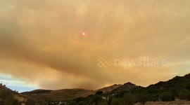Smoke Turns Sun Into Fiery Ember As Forest Fire Rages Near Navaluenga, Spain