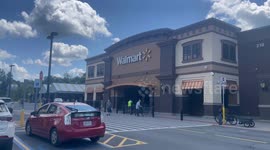 Walmart in Bennington Vermont with shoppers coming and going into store.