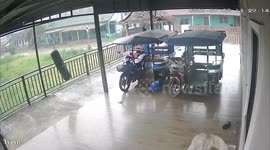 Wind blows away motorcycle and sidecar as typhoon lashes Thailand