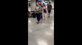Passengers delayed at Hong Kong airport amid typhoon onslaught