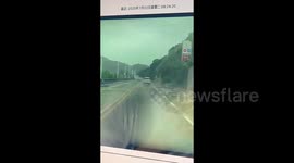 Lucky driver narrowly escapes disaster as landslide engulfs road in China
