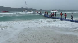 Tourists ride floating pontoon like a rollercoaster during typhoon onslaught