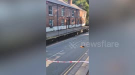 Driver arrested after double decker roof torn off in canal aqueduct crash