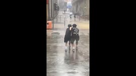 Locals struggle against wind during typhoon onslaught in Hong Kong