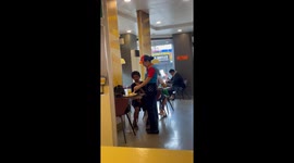 Fast food waitress helps disabled customer eat his lunch