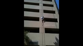 Repeling down the side of a building in Miami with full gear