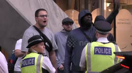 Anti Migrant Protesters gather outside Britannia International Hotel in Canary Wharf in East London where they allege migrants are being housed