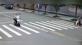 China: Biker Looking Down Crashes Into Truck He Didn’t See