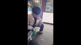 The Boy Divides the Duck Leg for the Dog