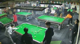 Man playing billiards hits ball into pocket of player on another table in hilarious scene