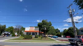 Dunkin Donuts in the town of Bennington Vermont busy and slow traffic.