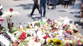 Mourners gather around Ozzy Osbourne’s star in the walk of fame. Los Angeles California.