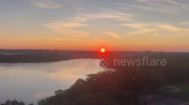 Serene Sunrise Over Boston Skyline from Cambridge’s Fresh Pond