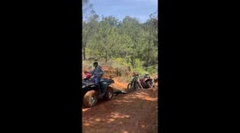 ATVs and bikes climb muddy hills in Villa Guerrero, Mexico