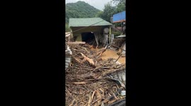 Gas station, houses and trees destroyed by flash floods in Vietnam