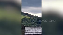 Tornado swirls above British village as family watch in shock