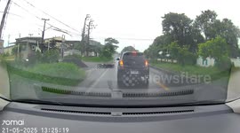 Motorists help elderly woman who falls from motorcycle on wet road