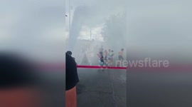 Tennessee firefighters use hose to help kindergarten kids cool off