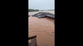 Woman and her pet dog stranded during floods rescued by boat