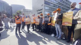 Striking resident doctors chant on a picket line outside a London hospital.