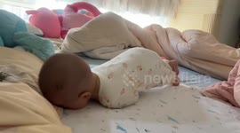 Newborn Baby Learns to Turn Over