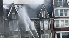 Murder enquiry, A man arrested on suspicion of murder after a body discovered, The Narrowcliff Hotel fire, Forensic teams and dogs investigate. Newquay Cornwall UK
