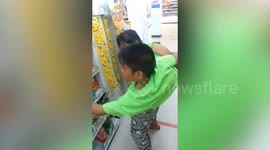 Conjoined twins go shopping at convenience store in Thailand