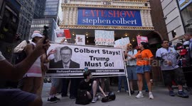 Anti-Trump protesters rally outside CBS Late Show Studio over Colbert firing