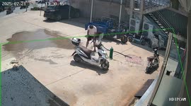 Man puts out fire on parked truck using small hose in Hebei, China