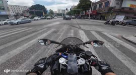 Motorcycle collision at intersection in Fujian, China
