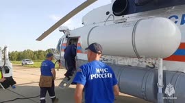Rescue teams advance through rough terrain to reach Russian plane crash site
