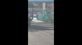 Man on e-bike crashes into container while distracted in Tianjin, China